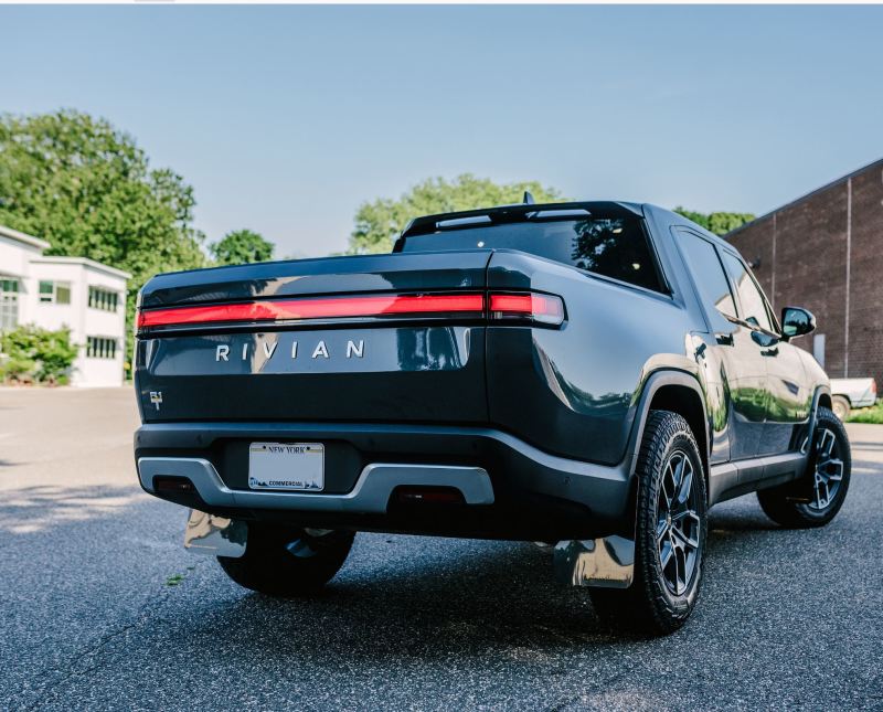 Rally Armor 22-25 Rivian R1T Black UR Mud Flap w/Tangerine Scream Logo