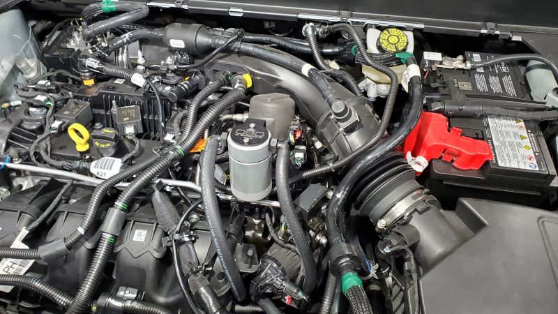 J&L 19-23 Ford/Lincoln SUVs & Trucks w 2.0 EcoBoost Driver Side Oil Separator 3.0 - Clear An